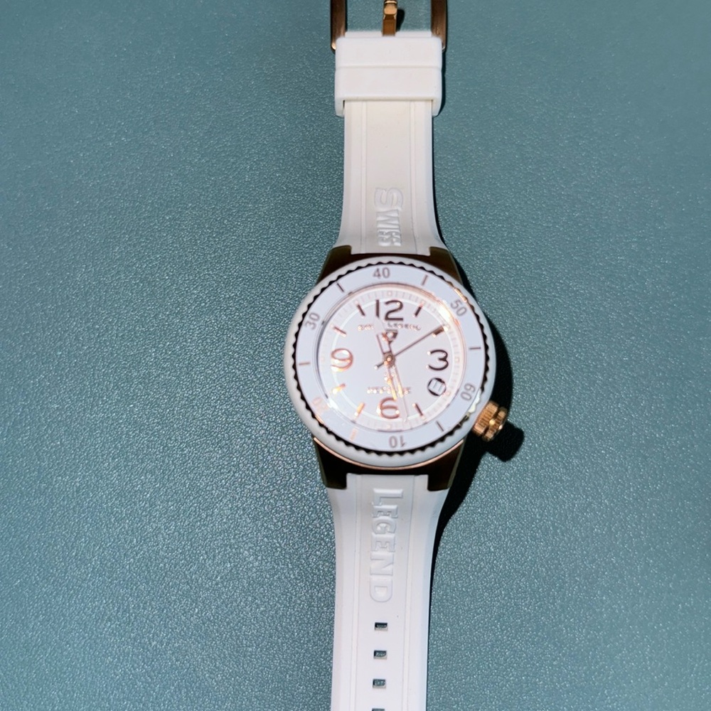 Swiss Legend, Neptune, white and rose gold watch. Has instruction manual.